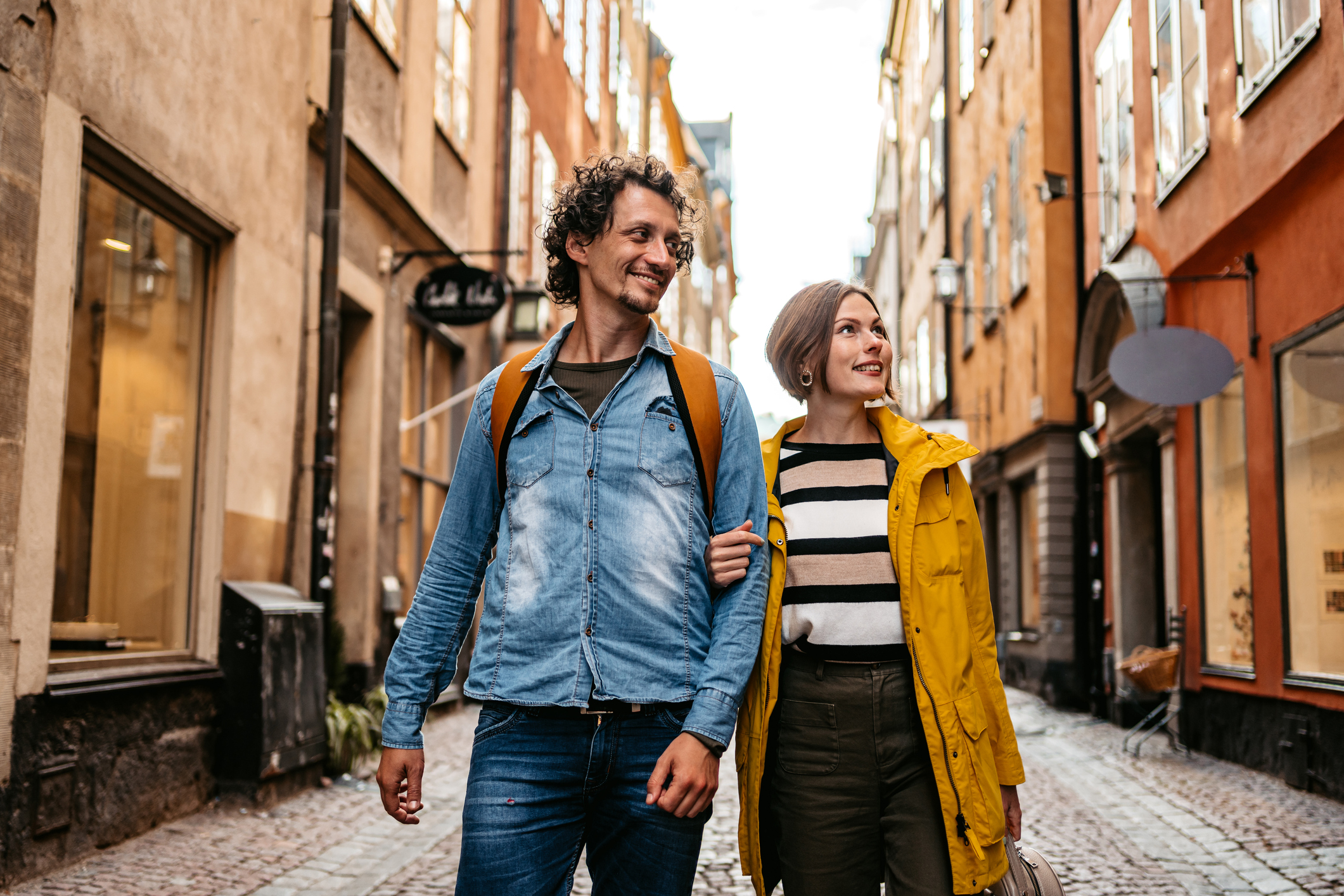 Beautiful young couple walking through the city in Stockholm, Sweden.